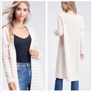 Cream colored light weight long sweater jacket.